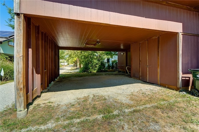 view of vehicle parking with a carport