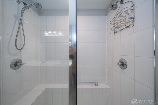 bathroom with a tile shower