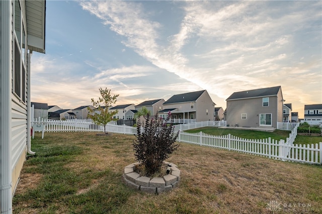 view of yard at dusk