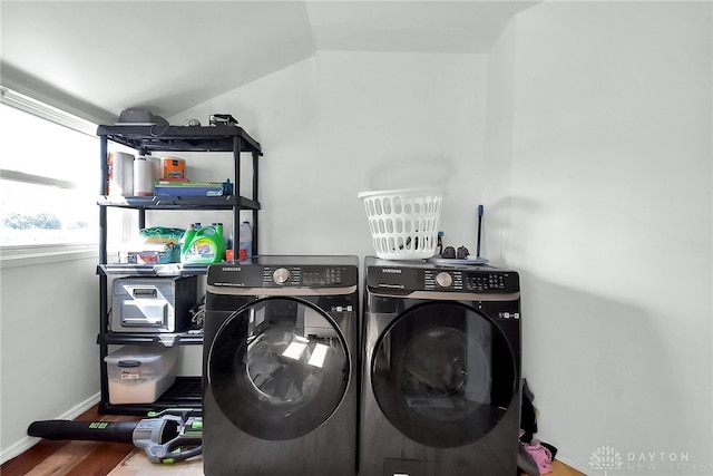 laundry area featuring hardwood / wood-style flooring and washer and clothes dryer