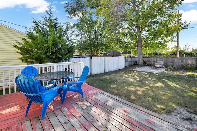 wooden deck with a yard