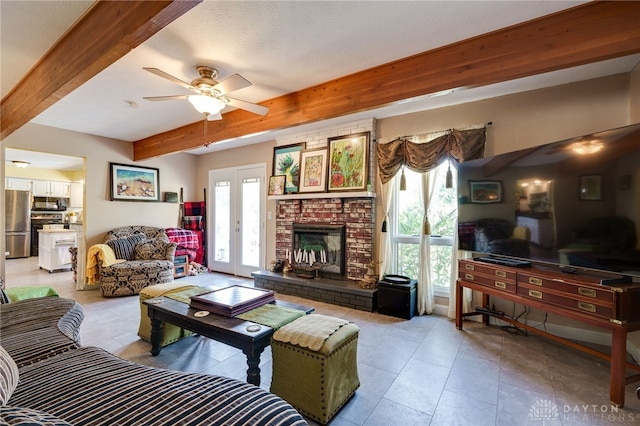 living room with beam ceiling, a wealth of natural light, french doors, and ceiling fan