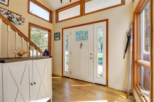 foyer with plenty of natural light and light hardwood / wood-style flooring