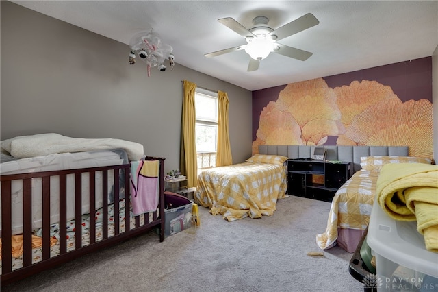 bedroom featuring ceiling fan and carpet floors