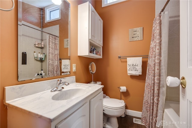 full bathroom with shower / bathtub combination with curtain, vanity, and toilet