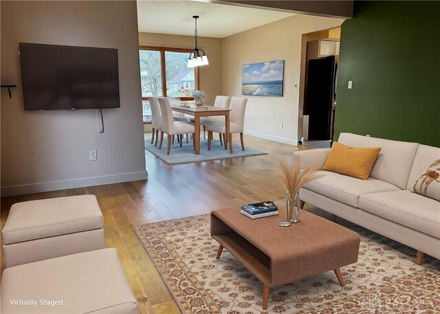 living room with light hardwood / wood-style flooring