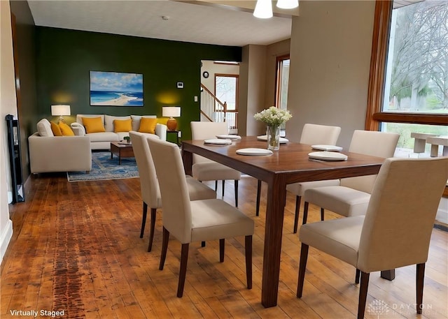 dining space with hardwood / wood-style flooring