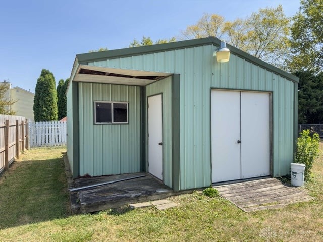 view of outbuilding featuring a yard