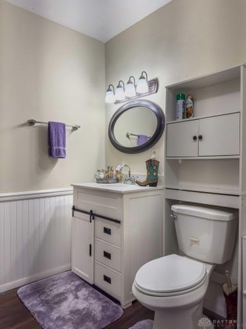 bathroom featuring vanity, hardwood / wood-style floors, and toilet