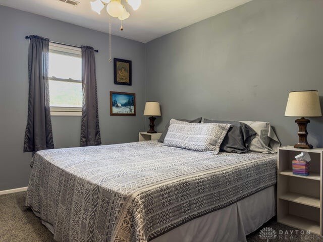 carpeted bedroom with ceiling fan