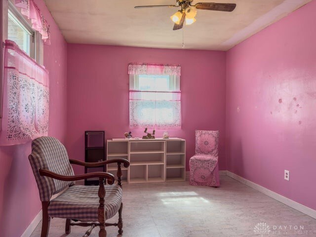 sitting room featuring ceiling fan