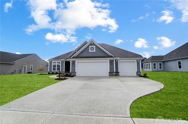 craftsman house with a garage and a front lawn