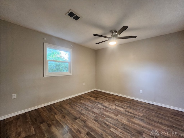 spare room featuring a textured ceiling, ceiling fan, and dark hardwood / wood-style floors