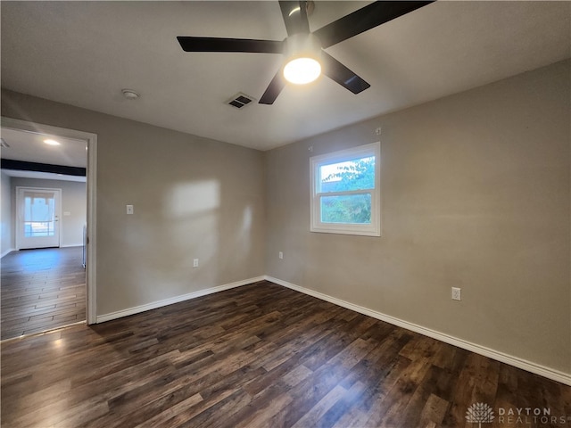 spare room featuring ceiling fan and dark hardwood / wood-style flooring