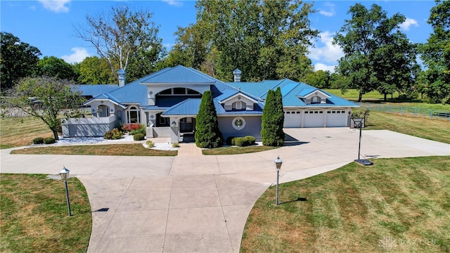 view of front facade with a garage and a front lawn