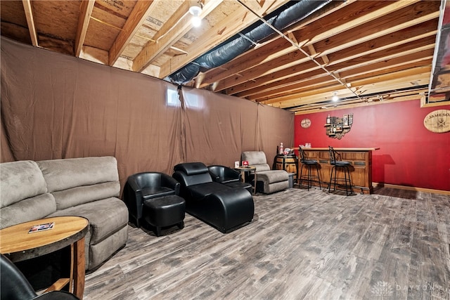 living room with wood-type flooring and bar