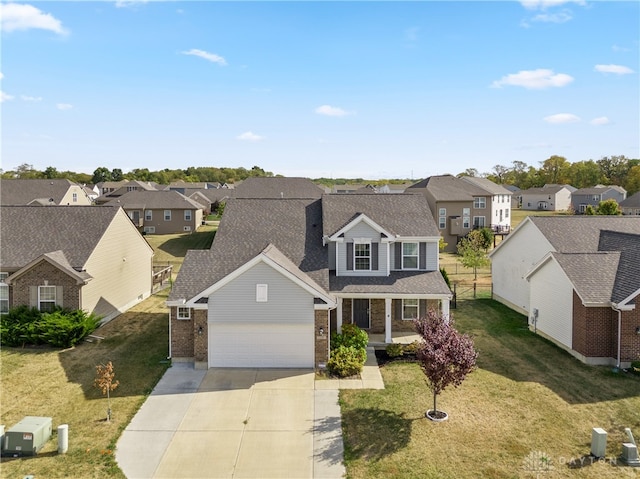 view of front property featuring a front yard and a garage