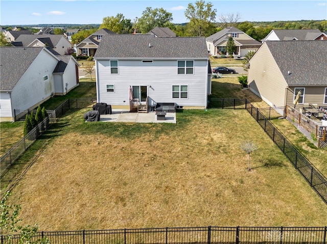 rear view of house featuring a lawn, outdoor lounge area, and a patio area