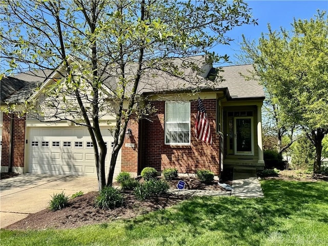 view of front of house with a front yard and a garage