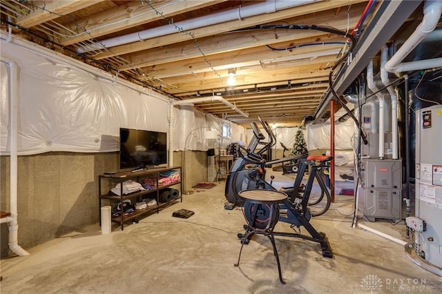 basement with gas water heater and heating unit