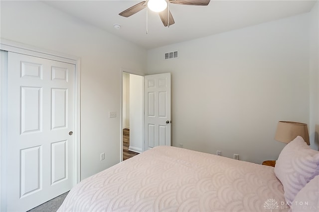 bedroom featuring ceiling fan and a closet