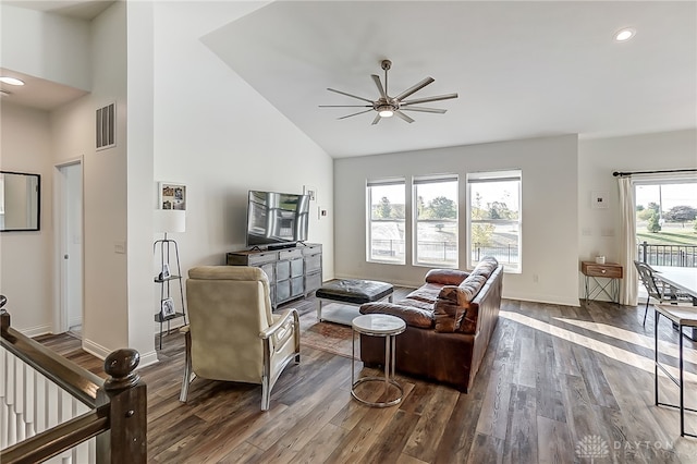 living room featuring vaulted ceiling, ceiling fan, and hardwood / wood-style flooring