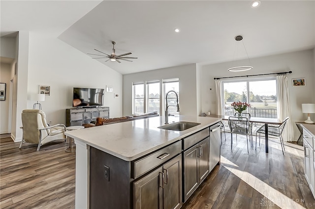 kitchen featuring dark brown cabinets, a kitchen island with sink, sink, dark hardwood / wood-style flooring, and ceiling fan