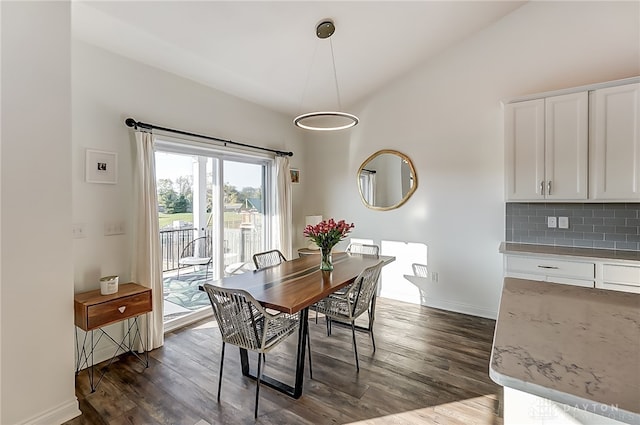 dining space featuring dark wood-type flooring