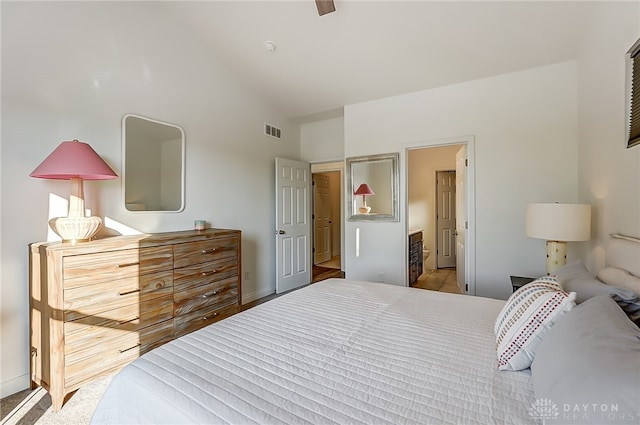 bedroom with ceiling fan and connected bathroom