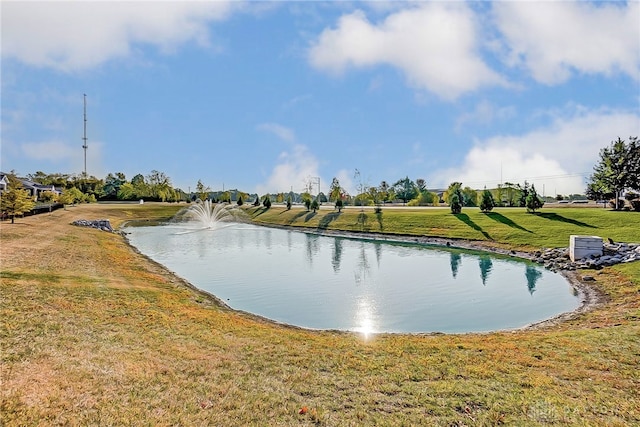 view of home's community featuring a water view and a yard