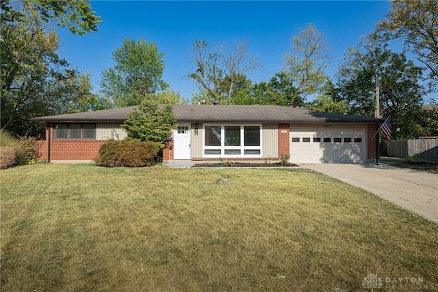 ranch-style home with a front lawn and a garage