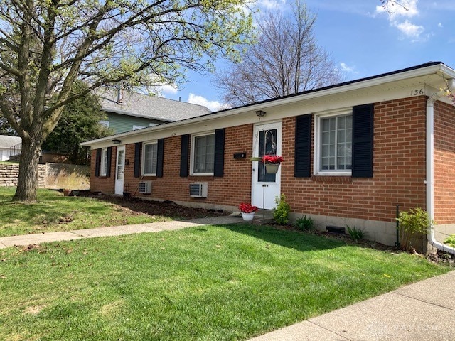 view of front of home with a front lawn