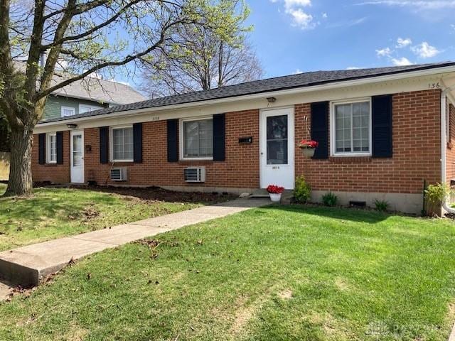 3136 Hassler St Unit 3136, Dayton, OH 45420 - view of front facade featuring brick siding, a front yard, and crawl space