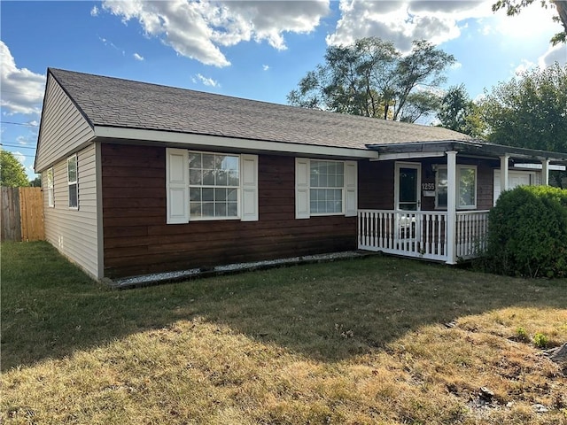 single story home with a front lawn and a porch