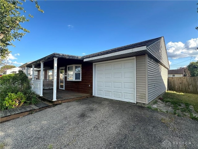 view of front facade with a garage and covered porch