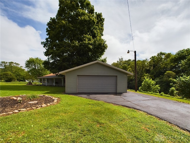 garage featuring a yard