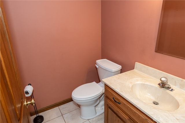 bathroom featuring tile patterned flooring, vanity, and toilet