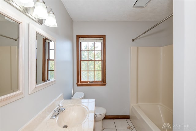 full bathroom featuring vanity, toilet, a textured ceiling, shower / bathtub combination, and tile patterned flooring