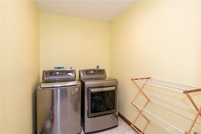 laundry room featuring washing machine and clothes dryer