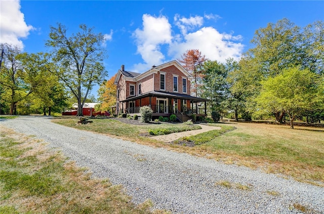 view of front of home featuring a front yard and covered porch