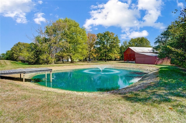 view of pool with a yard