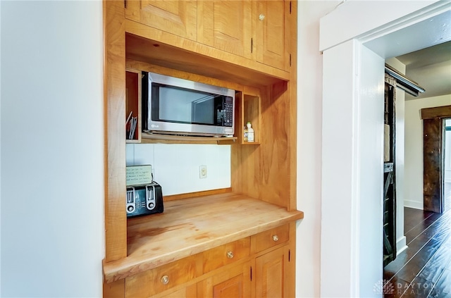 kitchen with wood counters and dark wood-type flooring