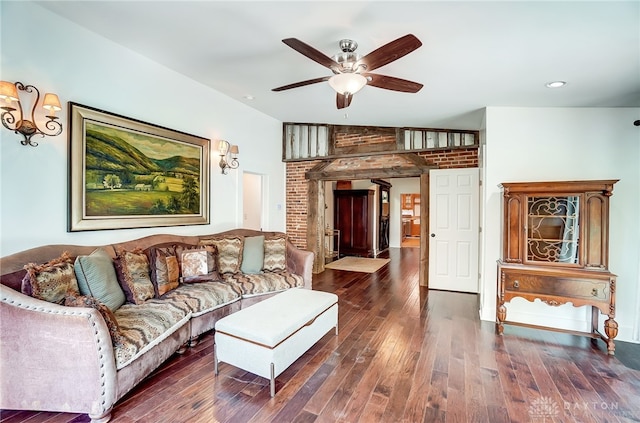 living room with dark wood-type flooring and ceiling fan