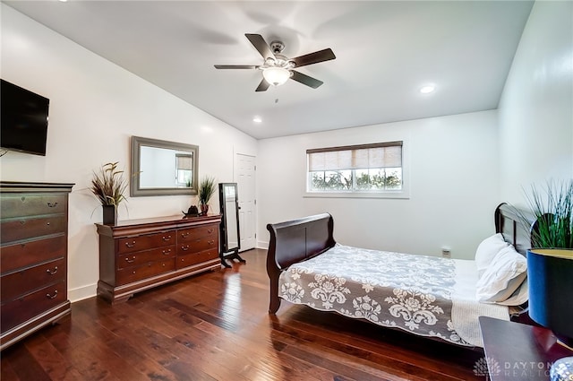 bedroom featuring vaulted ceiling, ceiling fan, and dark hardwood / wood-style flooring