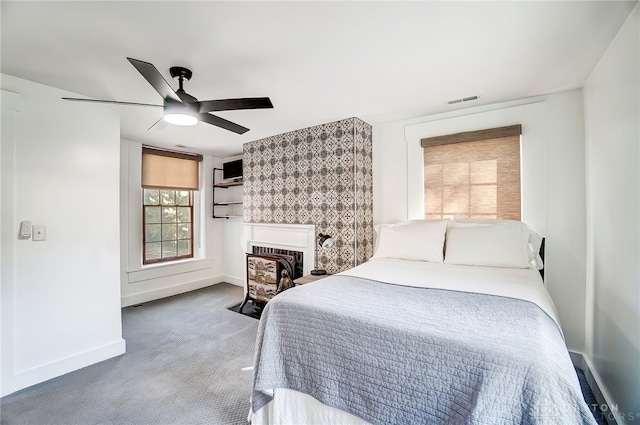 carpeted bedroom with ceiling fan