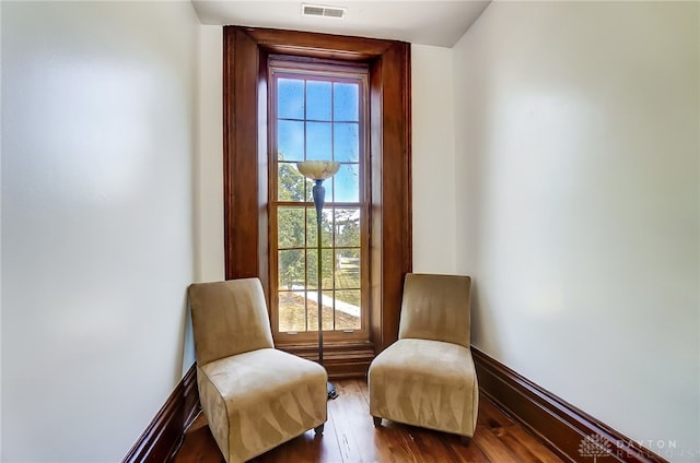 sitting room featuring wood-type flooring