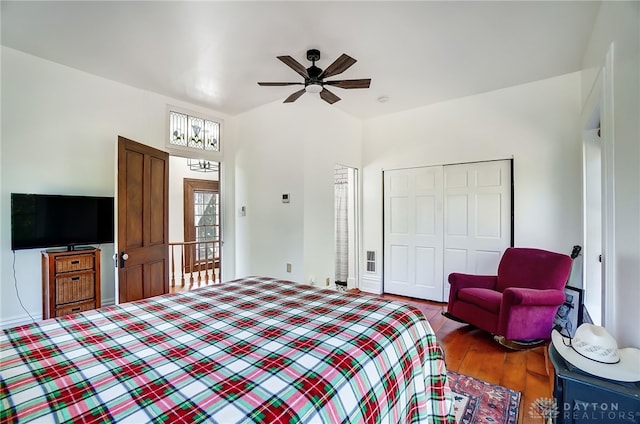 bedroom featuring a closet, ceiling fan, and dark hardwood / wood-style flooring