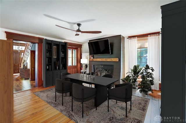 dining room featuring a wealth of natural light, ceiling fan, and hardwood / wood-style flooring