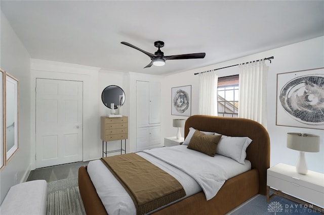 carpeted bedroom with ceiling fan