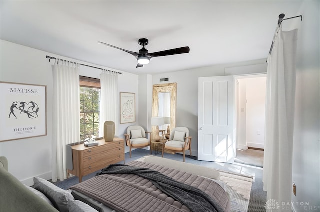 bedroom with ceiling fan and carpet flooring